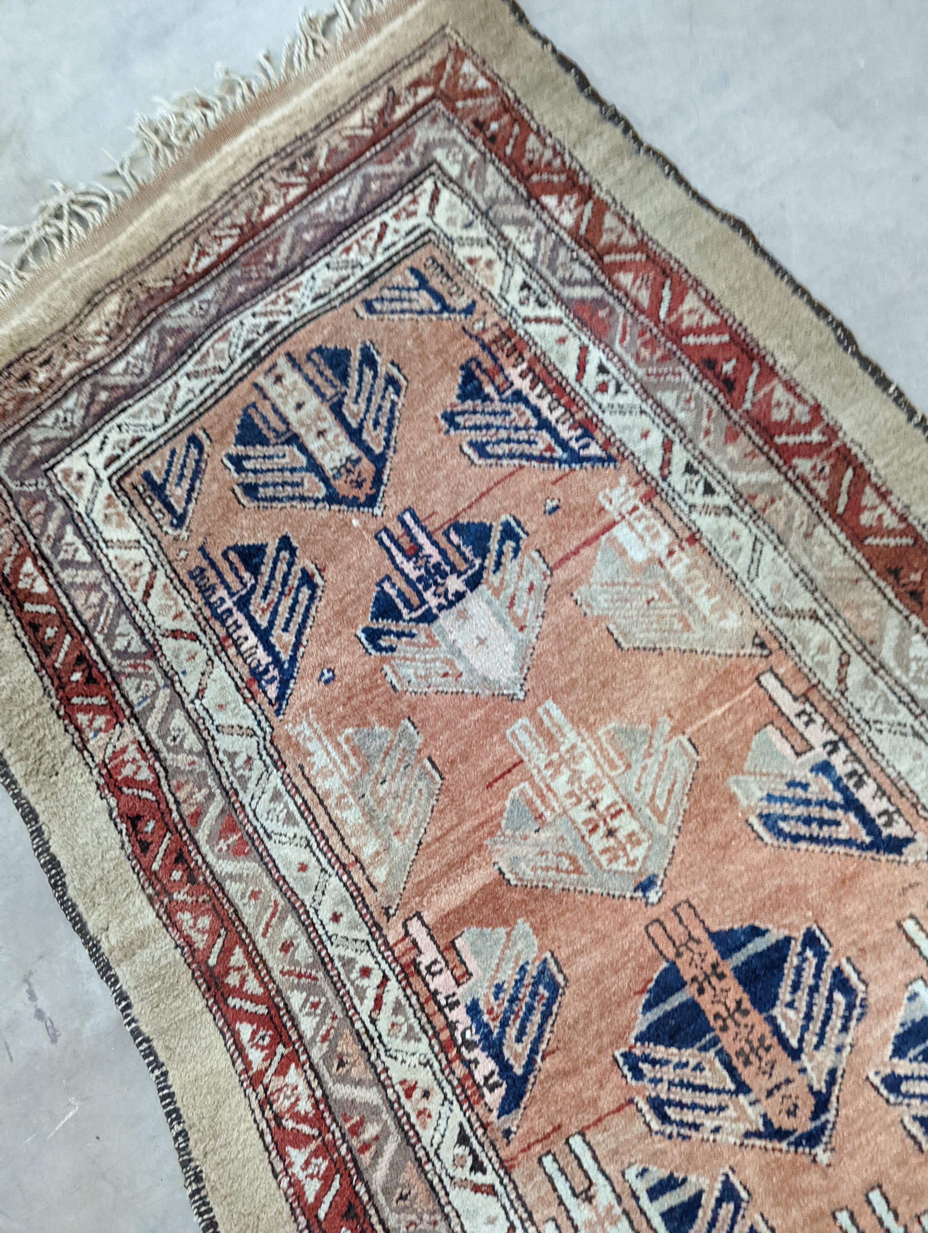 An Afghan brick red ground geometric runner and a smaller Afghan rug, larger 306 x 106cm